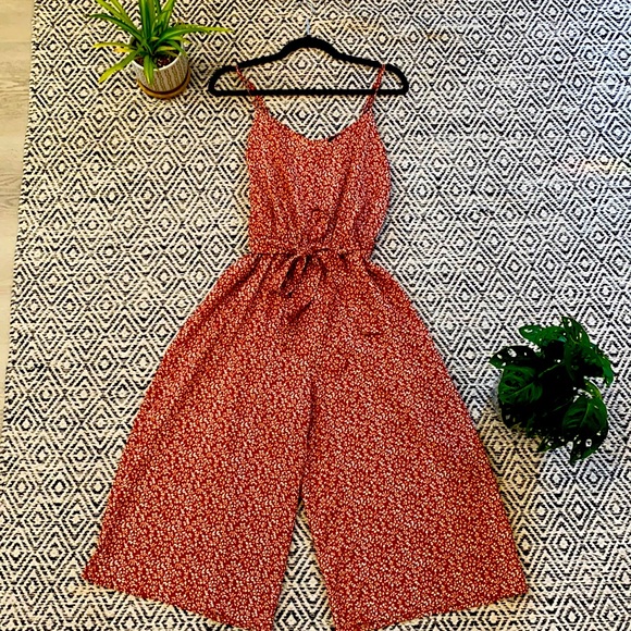 Cute burnt orange, floral jumpsuit, gently used - Picture 1 of 5